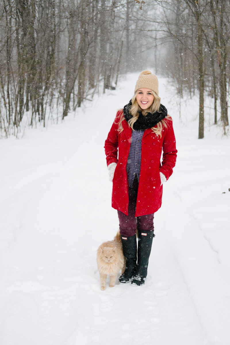 Debora Dahl wearing a red coat in the snow