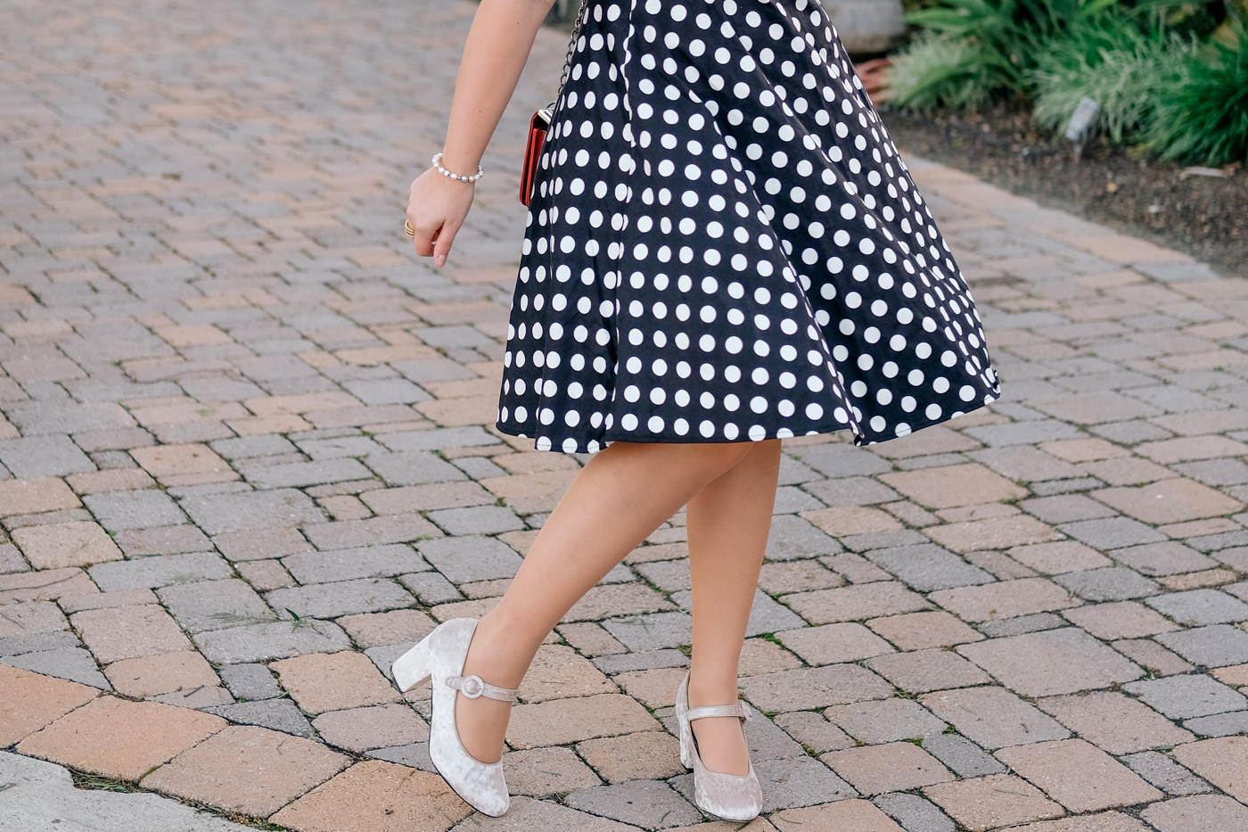 Debora Dahl wearing a polka dot dress and velvet shoes